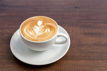 Coffee cup of rosetta latte art on wooden background with copy s - obrazy, fototapety, plakaty