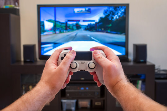 video game console controller in man hands