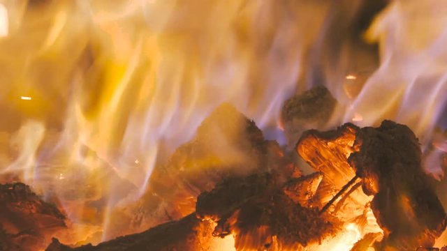 Close up of fire and flames of a bonfire burning in the night
