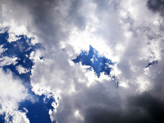 Backlit clouds on blue sky
