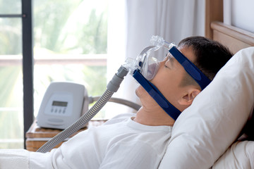 Sleep apnea therapy, Man wearing CPAP mask during a day break.
CPAP:Continuous positive airway...