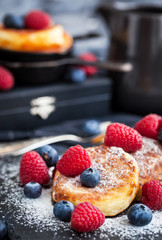 Cottage cheese pancakes decorated with fresh berries