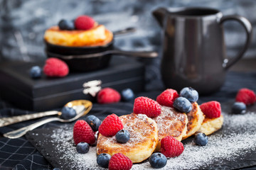Cottage cheese pancakes decorated with fresh berries