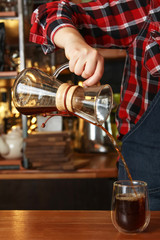 Barista pouring coffee