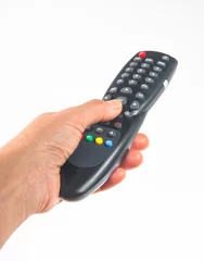 hand holding a remote control © Wingedbull