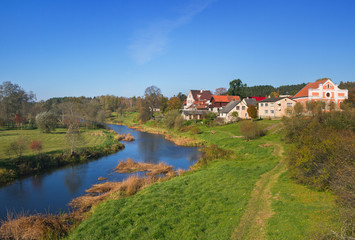 Fototapeta na wymiar Small hamlet at the river.