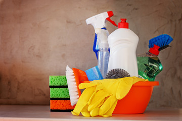Cleaning set with products and supplies on kitchen table