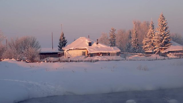 Russian country house izba in Altai village Semiletka on the bank of river Koksha,  Siberia, Russia

