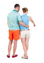 young couple pointing.