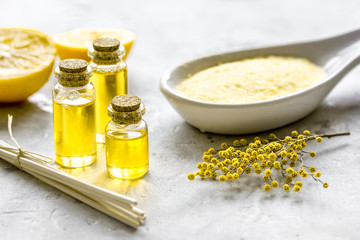 Natural bath salt and organic oil on gray background