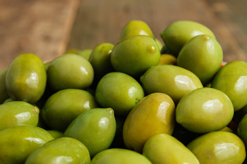 Green olives background. Top view.
