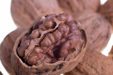 Shelled walnuts on a white background. Isolated. Dried nuts. Close up.
