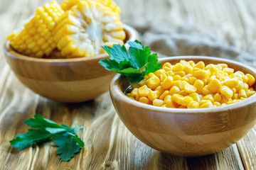 Canned corn in a wooden bowl. © Saprunova Marina