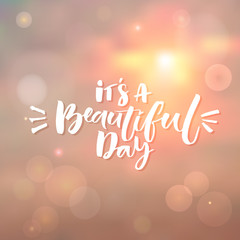 It's a beautiful day. Inspiration quote at morning sky background with bokeh light effects