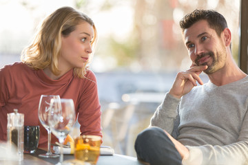 Young couple dating in restaurant