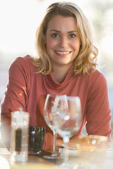 beautiful woman sitting in a restaurant