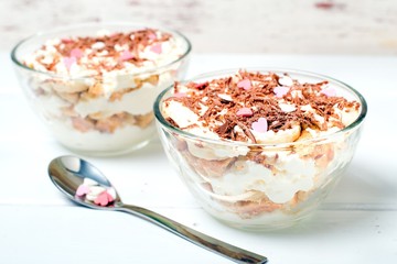 Cheesecake dessert in glass jar on wooden background. Healthy dessert. Healthy food concept.