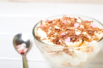 Cheesecake dessert in glass jar on wooden background. Healthy dessert. Healthy food concept.