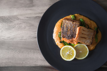 Pan seared salmon with potato puree and young broccoli