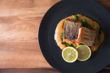 Pan seared salmon with potato puree and young broccoli