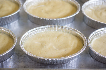 uncooking , making cakes, Close up uncooking cake on steel tray.