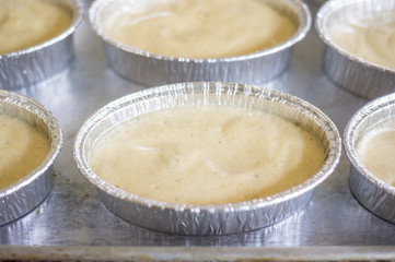 uncooking , making cakes, Close up uncooking cake on steel tray.
