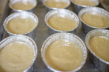 uncooking , making cakes, Close up uncooking cake on steel tray.