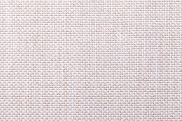 White and beige textile background with checkered pattern, closeup. Structure of the fabric macro.