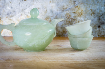 jade cup,cup of tea, Chinese jade cup of tea on wooden background. Chinese jade cup Decoration.