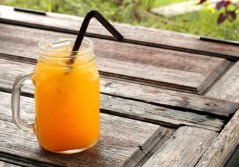 Orange juice on the wooden floor