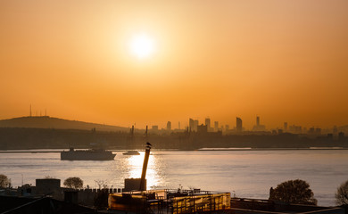 Beautiful view at Bosporus channel over traditional Istanbul cityscape, turkish style architecture, silhouette landscape. Dawn scenery. Istanbul, Turkey.