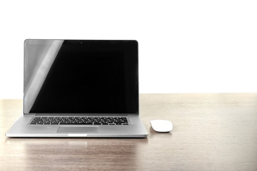 Modern laptop on wooden desk