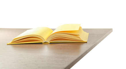 Open book on wooden table