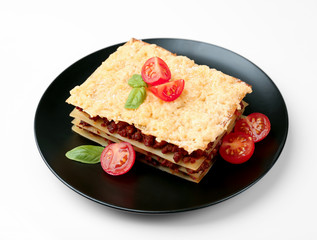 Tasty homemade Italian lasagna, white background