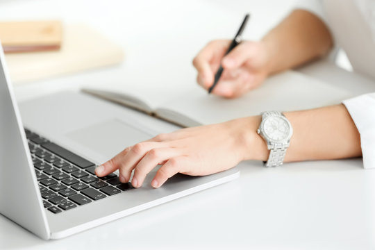 Young woman working in office, closeup