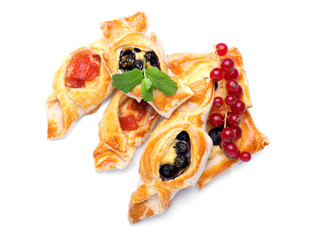 Tasty puff pastry with berries on white background