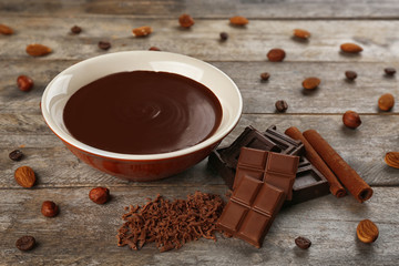Bowl with chocolate mousse,on wooden background