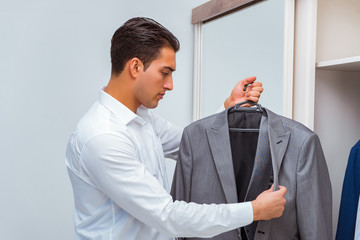 Businessman dressing up for work