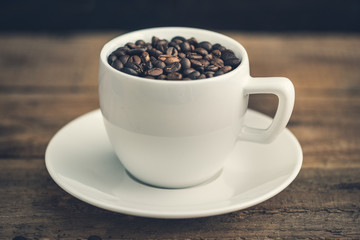 Ceramic Cup Full of Roasted Coffee Beans