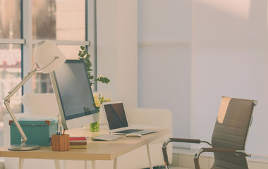 Workplace with computer on table in modern room