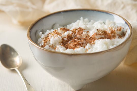 Traditional rice pudding with cinnamon. Light background. Tasty