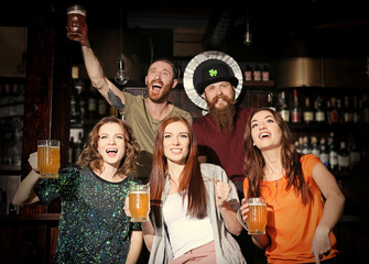 People celebrating Saint Patrick's Day in pub