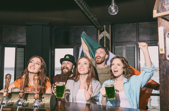 People celebrating Saint Patrick's Day in pub