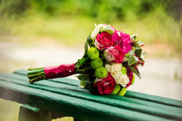 beautiful bridal bouquet lying on the bench, a beautiful wedding bouquet, spring flowers