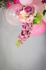 Pink balloons decorated with a bouquet of roses on a blue background