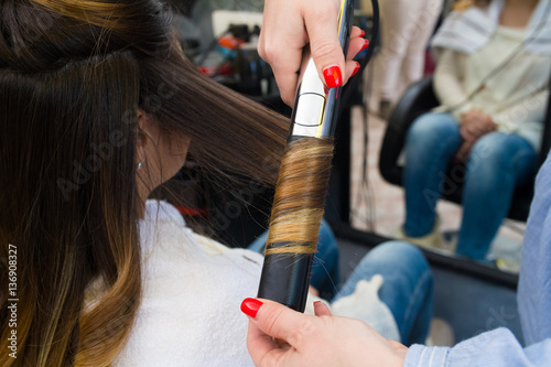 Professional Hairdresser Curling Ombre Hair With Iron Stock Photo