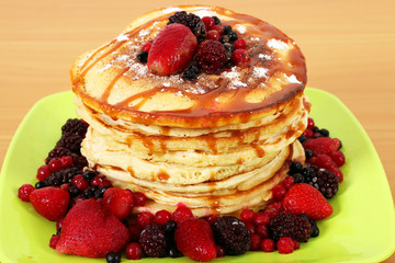 pancakes with berries on plate