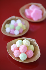 ひな祭り　お菓子　朱色の背景