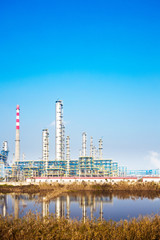 Fototapeta premium oil refinery plant near river