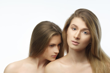 Portrait of two attractive caucasian women blond, studio shot
